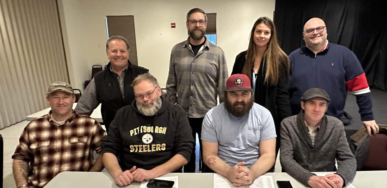 Group of diverse UFCW Local 371 members gathered in a meeting room.