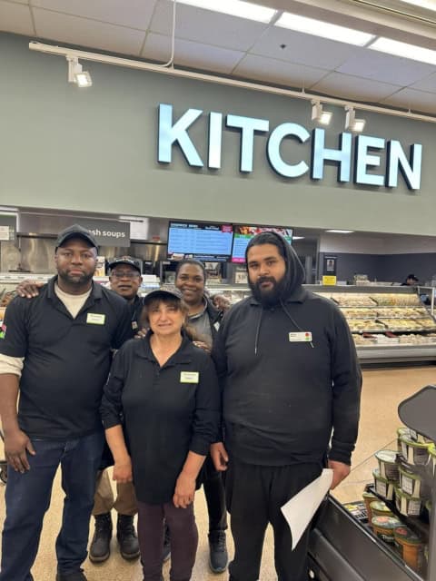 Stop & Shop kitchen staff standing together in the store.