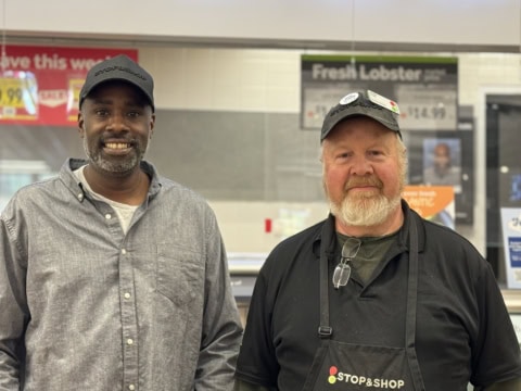 Two Stop & Shop workers smiling in the store.