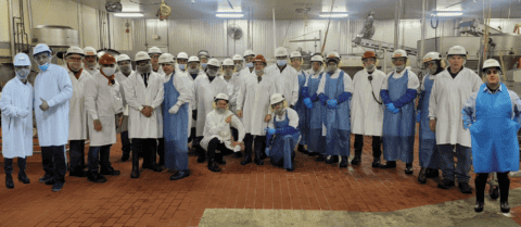 Carando Smithfield workers wearing protective gear on the production floor.