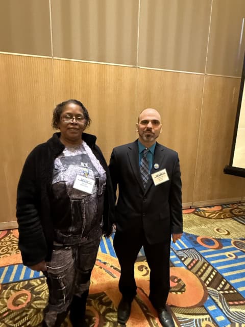 Two UFCW conference attendees standing together.