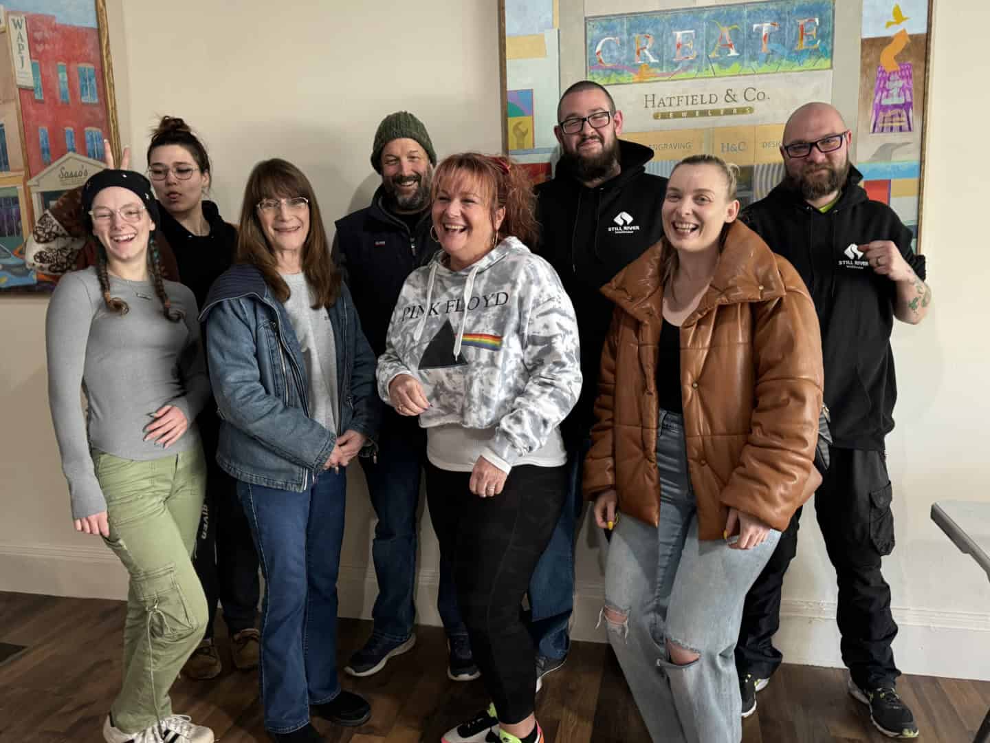 Still River Wellness workers standing together indoors.