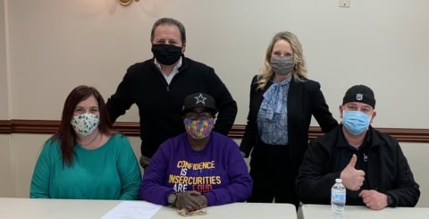 Whitney Rehabilitation workers wearing masks at a meeting.