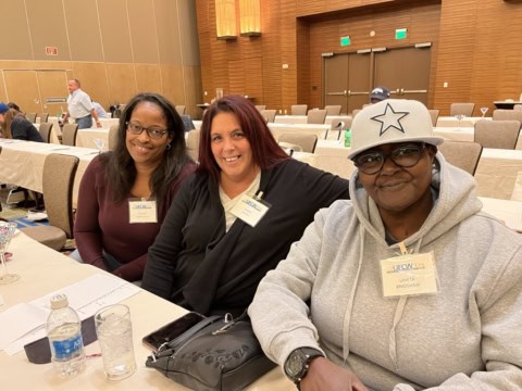 Three Whitney Rehabilitation workers at a UFCW Local 371 conference.